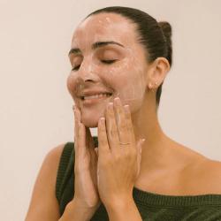 Woman apply Eco Tan by Sonya to her face