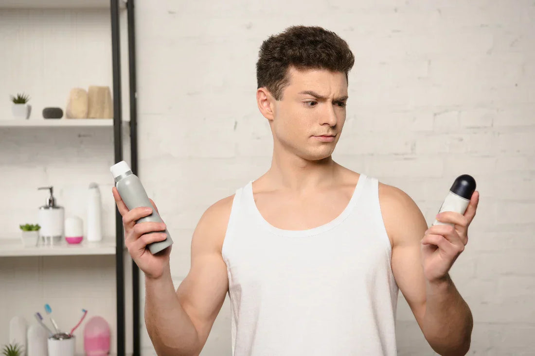Man deciding between deodorants, wonderying why aluminum deodorant is bad for you