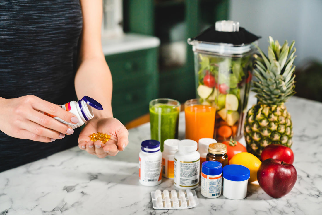 Person taking their multivitamin supplements, with other multivitamins on their counter